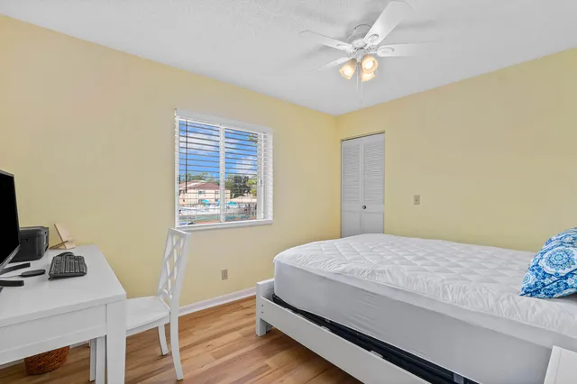 a bedroom with a bed and a table