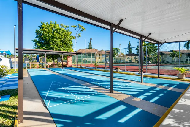 a view of a swimming pool with a porch