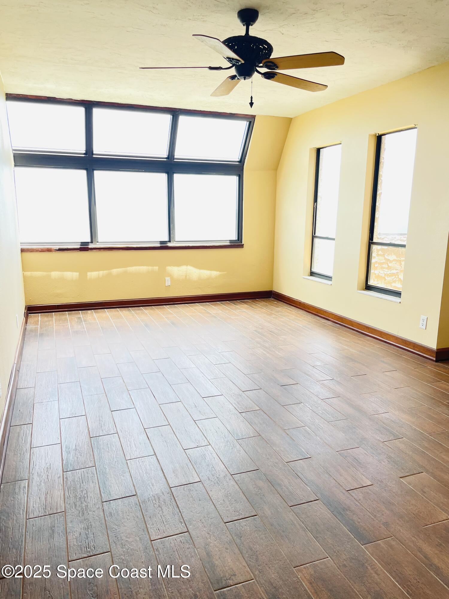1540 Riverside Drive, Unit 14 Titusville, FL 32780 - Photo 12 of 29 a view of a livingroom with an empty space and a window