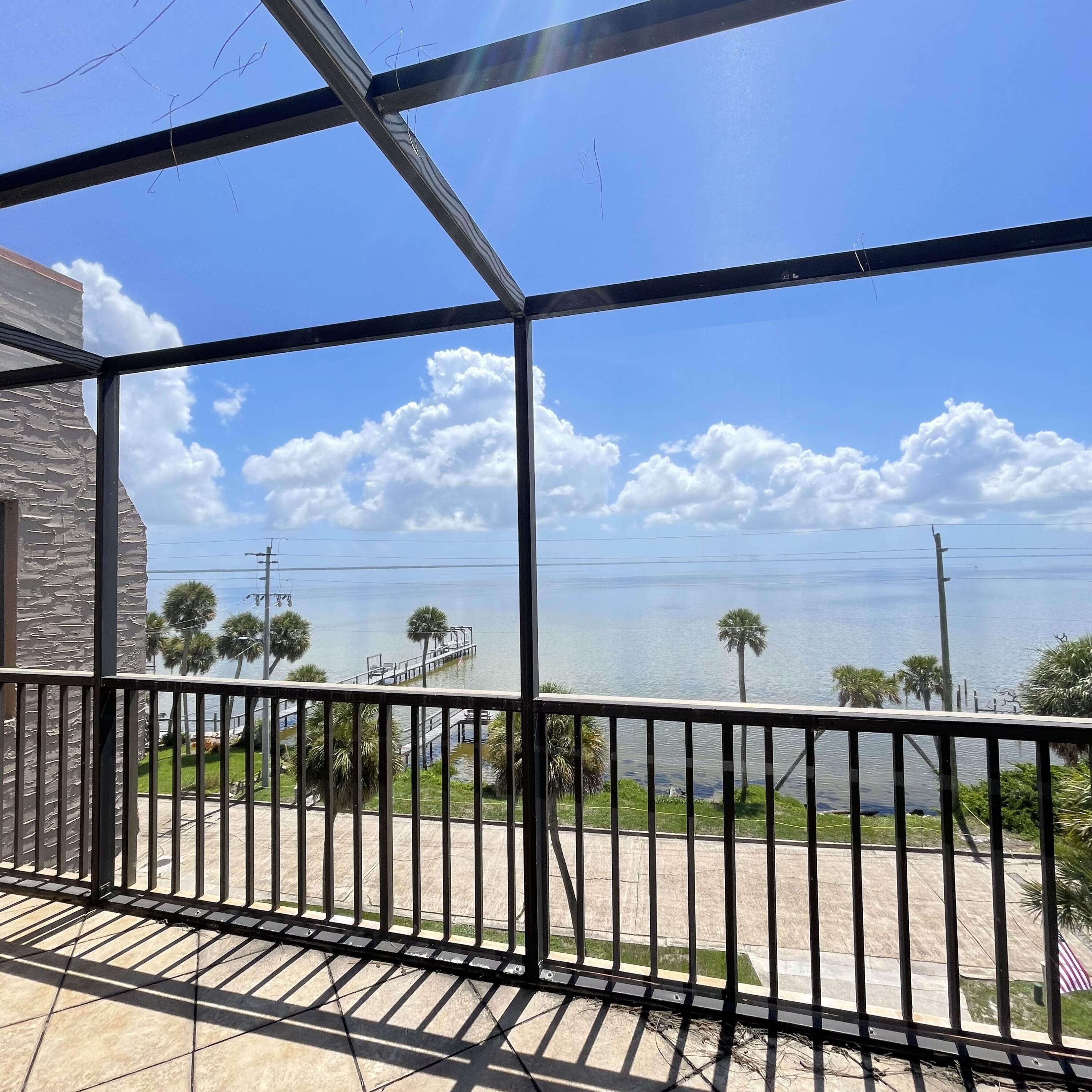 1540 Riverside Drive, Unit 14 Titusville, FL 32780 - Photo 3 of 29 a view of a glass door