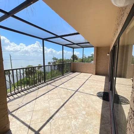 a view of balcony with a floor to ceiling window