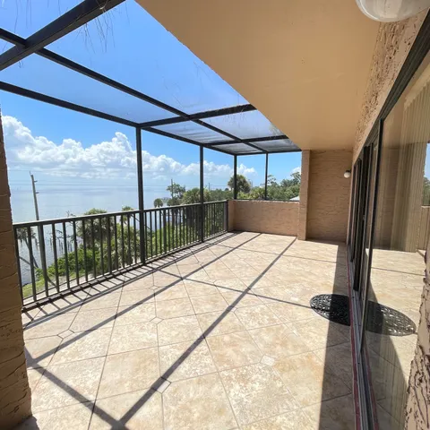 a view of balcony with a floor to ceiling window