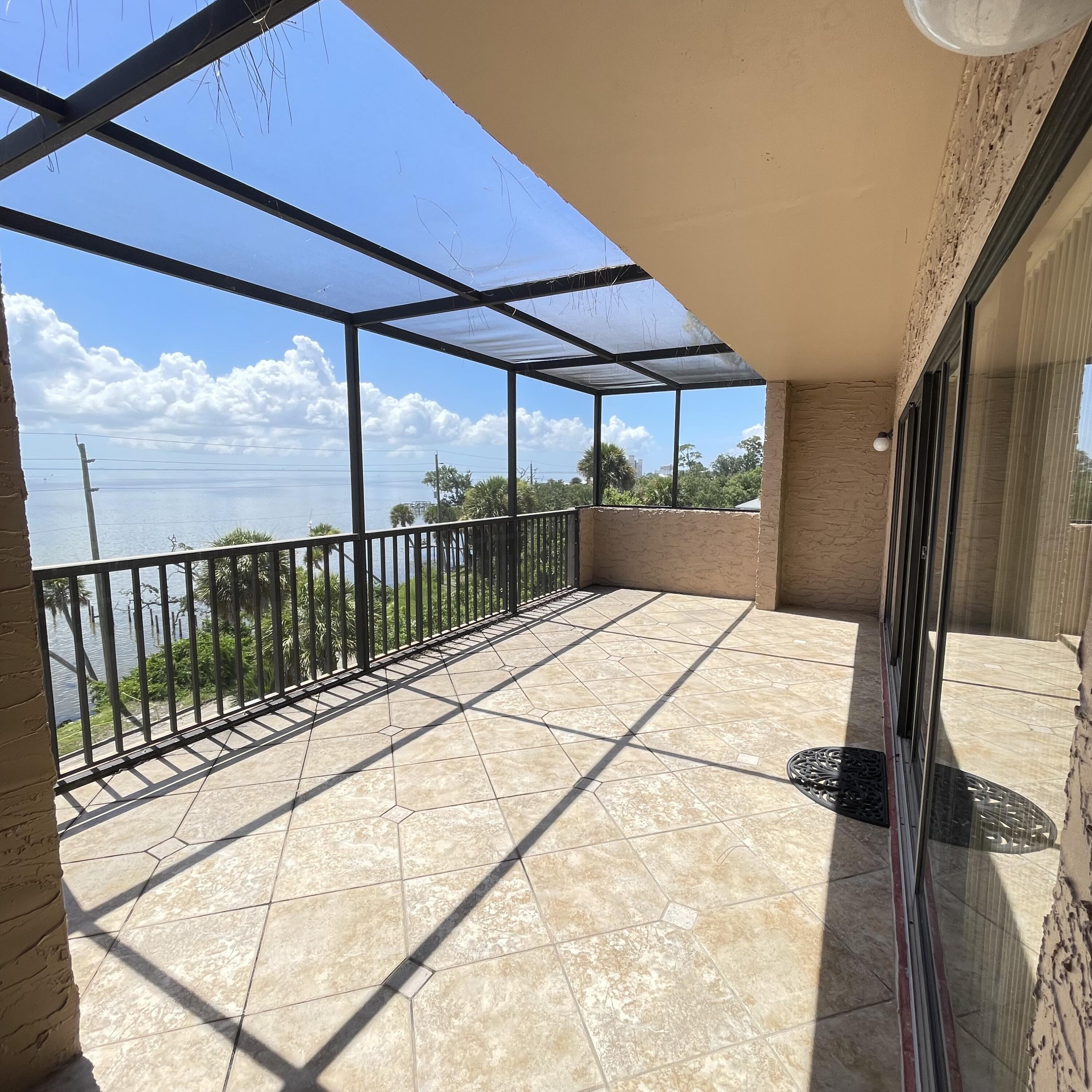 1540 Riverside Drive, Unit 14 Titusville, FL 32780 - Photo 5 of 29 a view of balcony with a floor to ceiling window