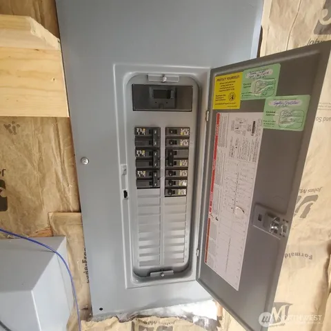 a view of a dirt road with trees in the background
