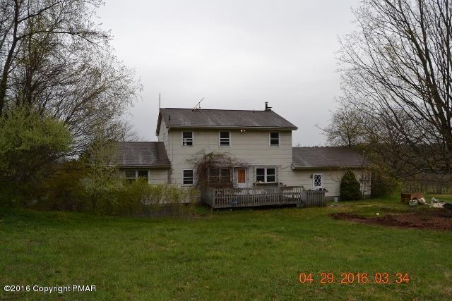 159 Doney Road Gilbert, PA 18331 - Photo 3 of 14 a front view of a house with a garden and plants
