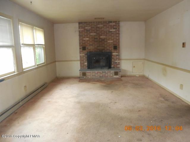 159 Doney Road Gilbert, PA 18331 - Photo 6 of 14 an empty room with windows