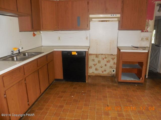 159 Doney Road Gilbert, PA 18331 - Photo 8 of 14 a kitchen with stainless steel appliances a cabinets and a counter top space