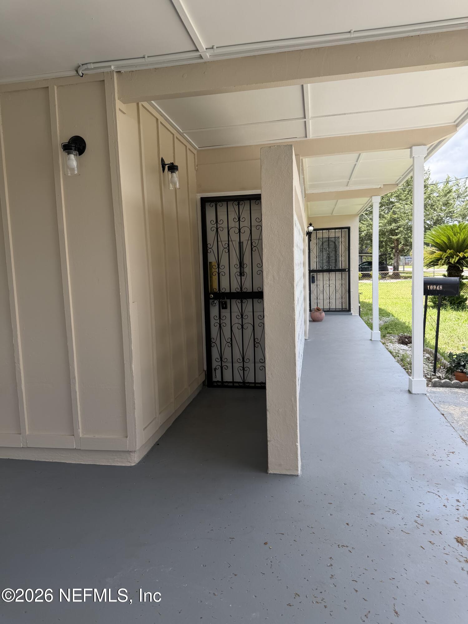 10948 Java Drive Jacksonville, FL 32246 - Photo 2 of 31 a view of empty room with floor to ceiling window
