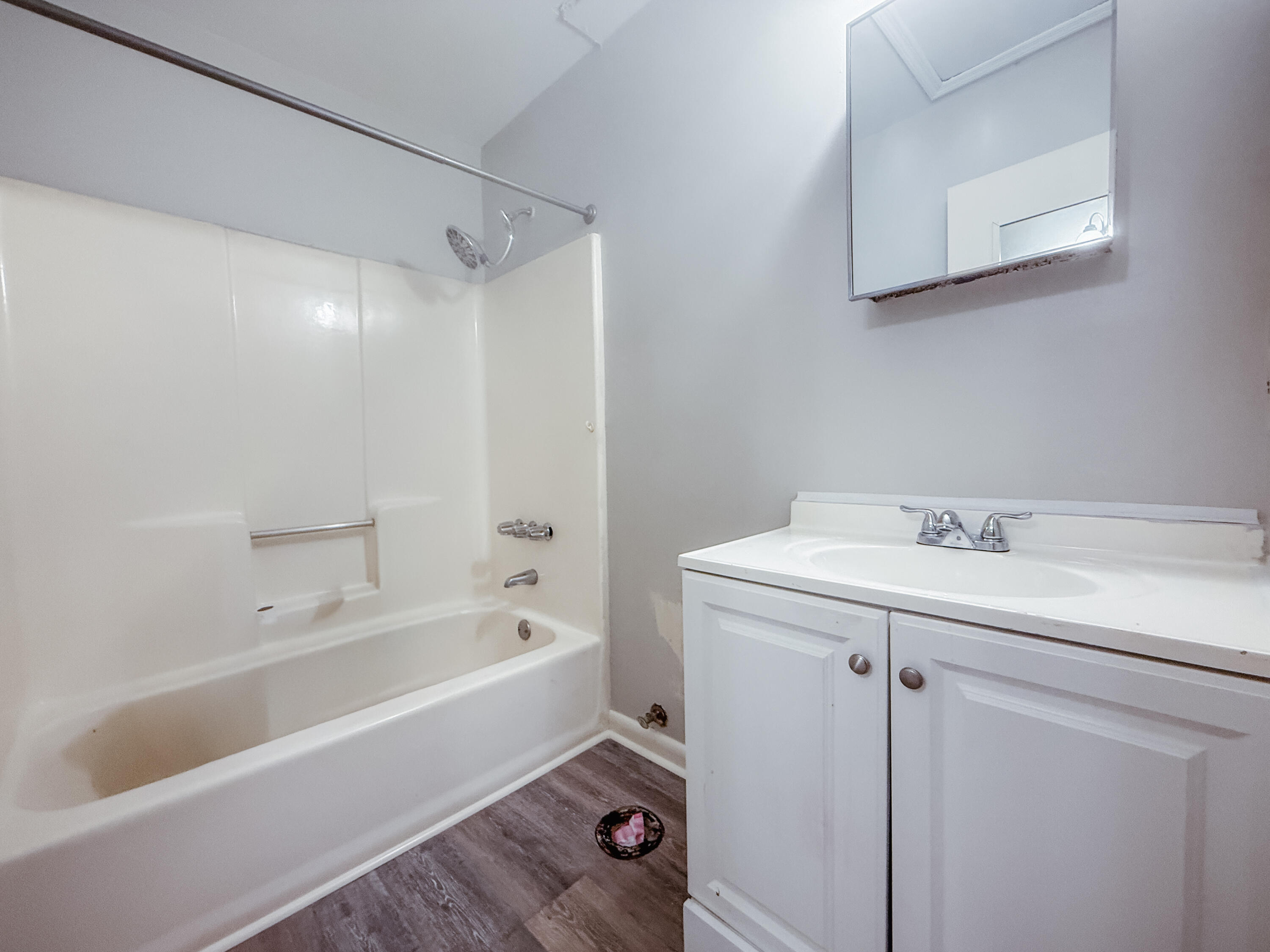 4260 Highway 90, Unit 42 Pace, FL 32571 - Photo 8 of 10 a bathroom with a bathtub a sink and a shower