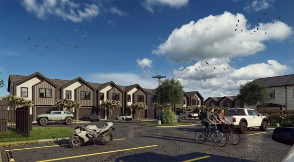 a view of a house with backyard outdoor seating and a patio