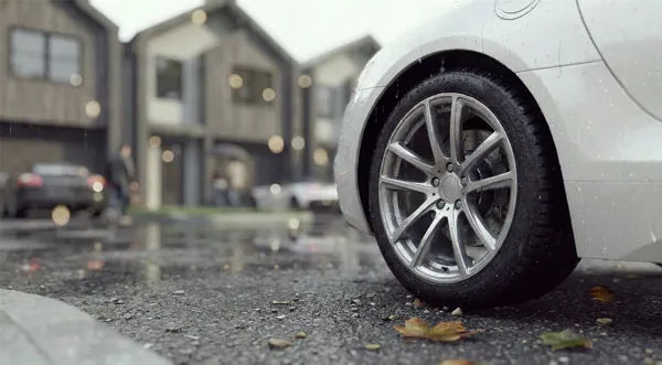 a view of a house with a yard and car parked