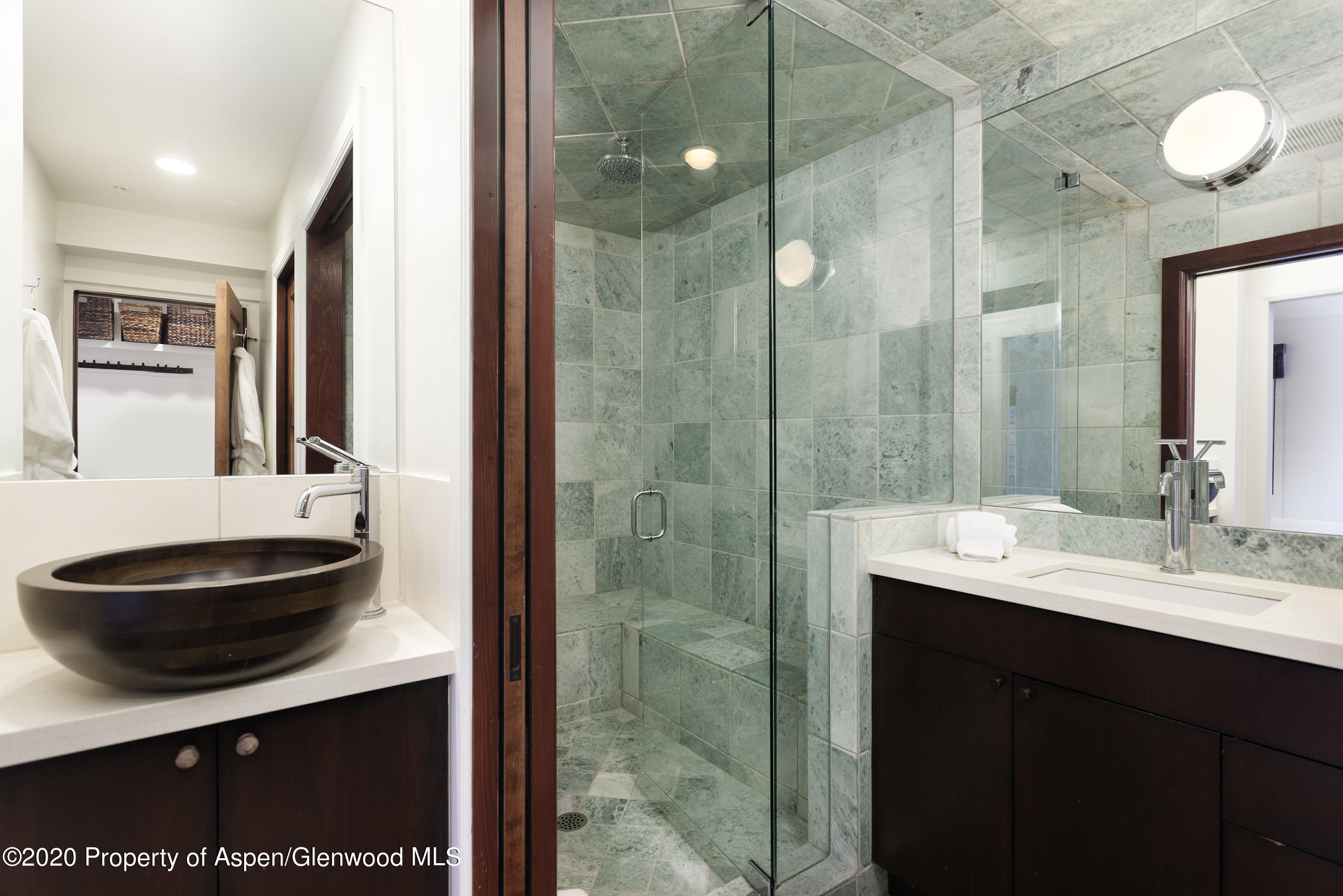 900 East Durant Avenue, Unit E114 Aspen, CO 81611 - Photo 11 of 13 a bathroom with a sink a toilet and a mirror
