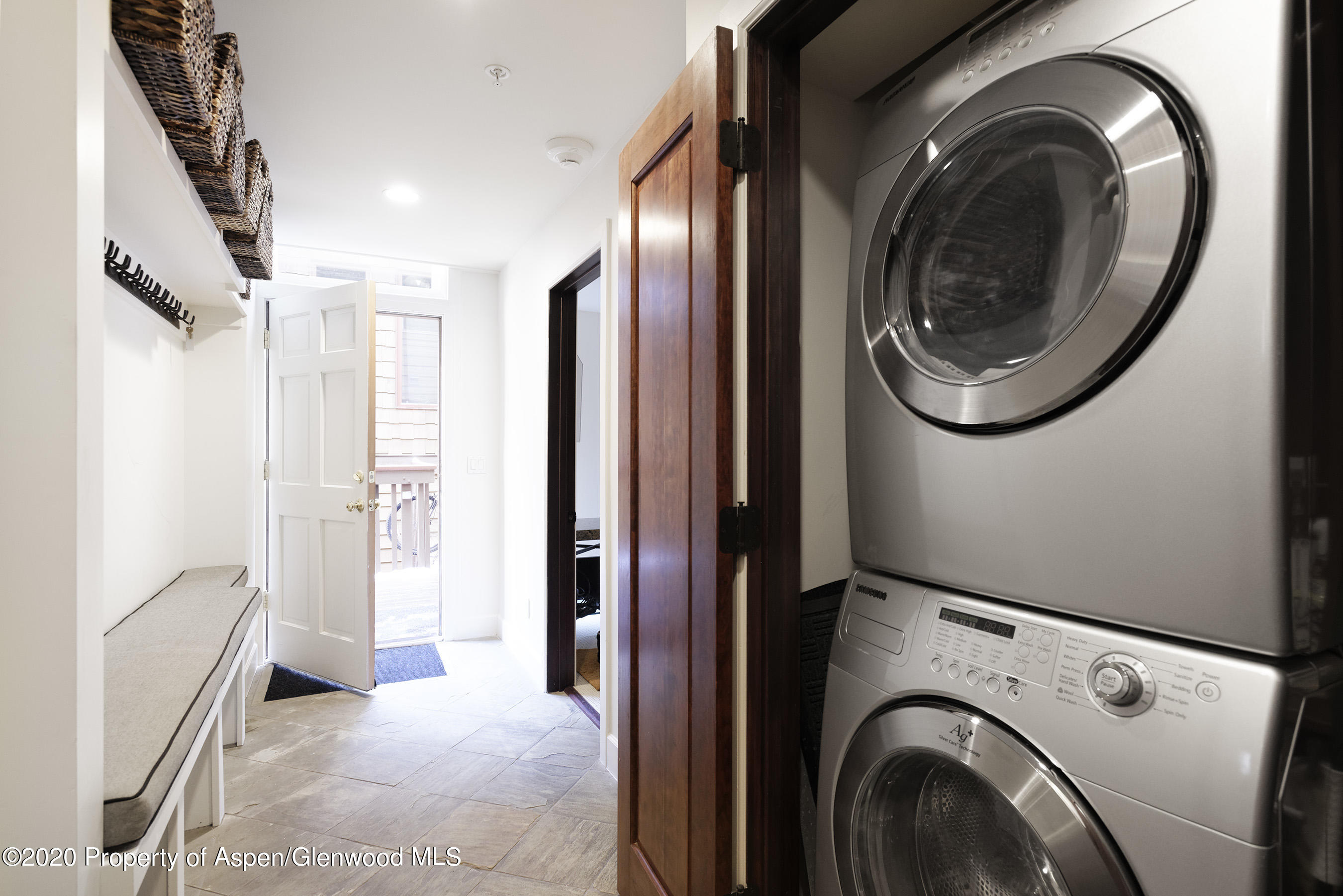 900 East Durant Avenue, Unit E114 Aspen, CO 81611 - Photo 13 of 13 a view of a hallway with washer and dryer