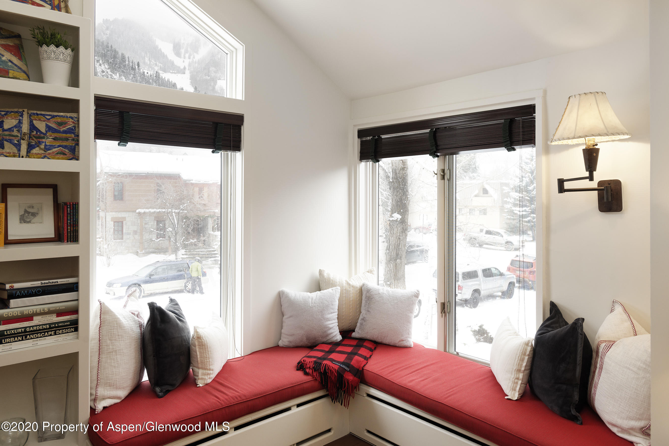 900 East Durant Avenue, Unit E114 Aspen, CO 81611 - Photo 3 of 13 a bedroom with furniture and a large window