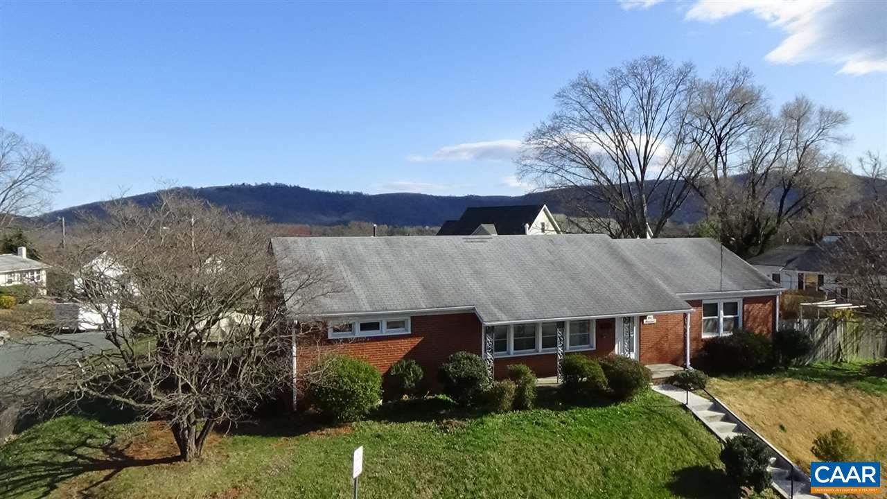 an aerial view of a house with a big yard