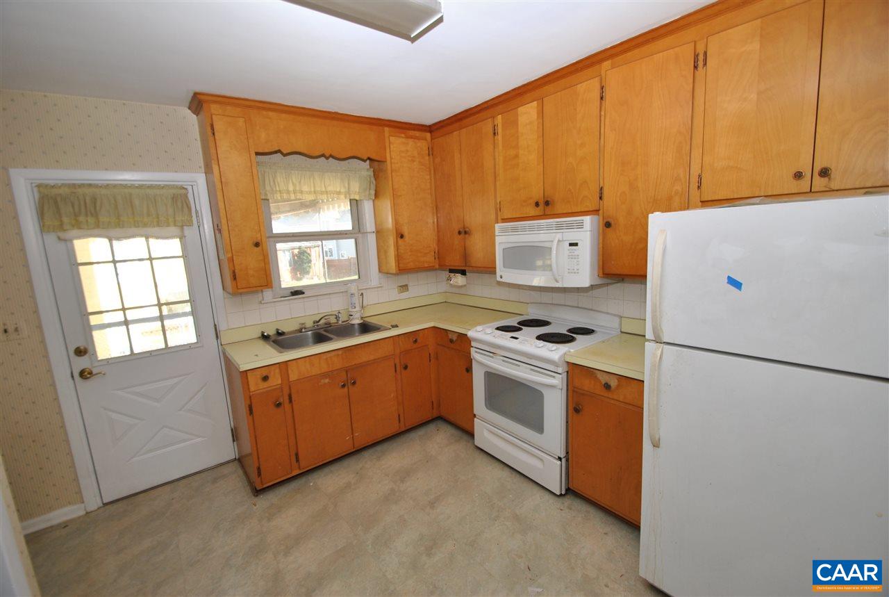 1000 Ridge Street Charlottesville, VA 22902 - Photo 11 of 17 a kitchen with stainless steel appliances granite countertop a stove a refrigerator and a refrigerator