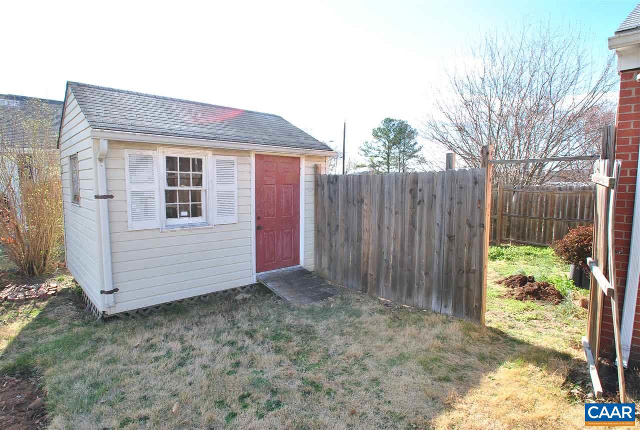 1000 Ridge Street Charlottesville, VA 22902 - Photo 14 of 17 a view of a house with a small yard and wooden fence