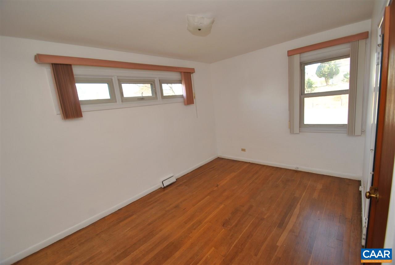 1000 Ridge Street Charlottesville, VA 22902 - Photo 7 of 17 an empty room with wooden floor and windows