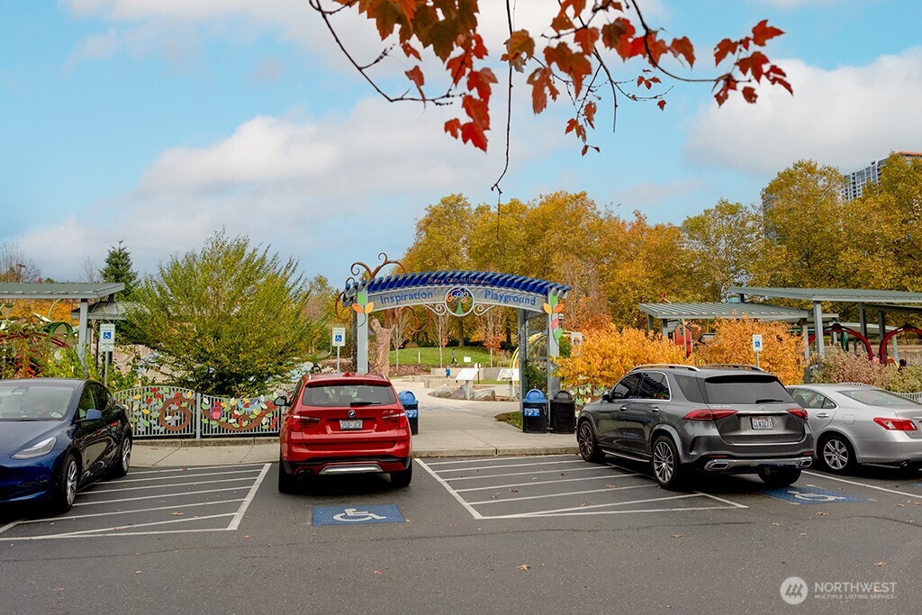 10042 Main Street, Unit 203 Bellevue, WA 98004 - Photo 23 of 30 a car parked in front of a house