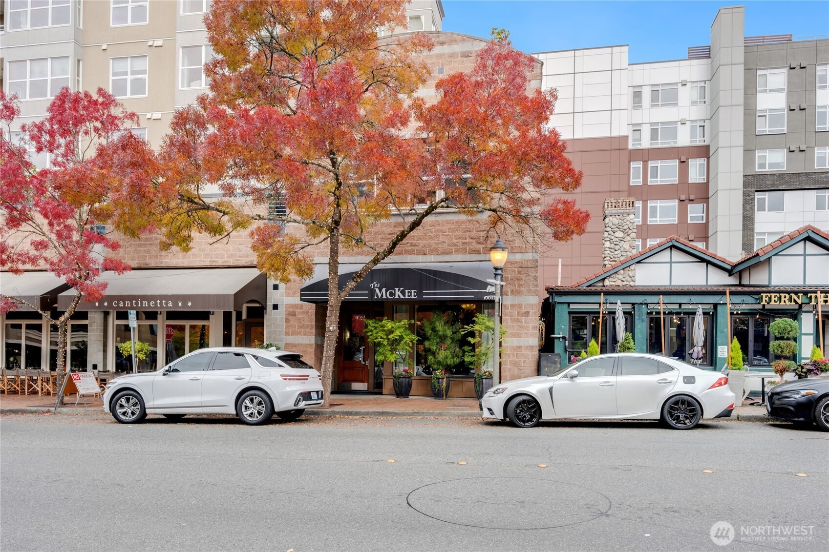 10042 Main Street, Unit 203 Bellevue, WA 98004 - Photo 26 of 30 a car parked in front of a building