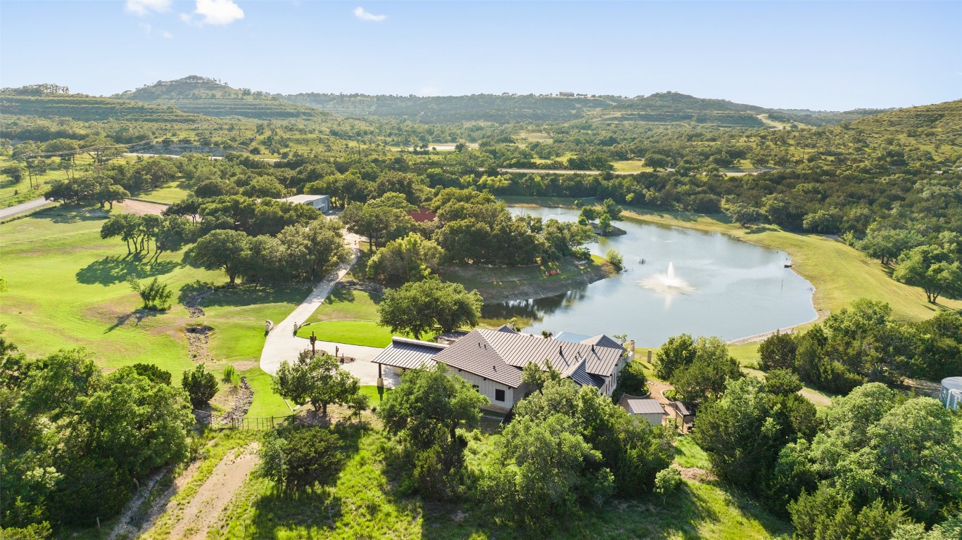101 Rolling Hills Road Blanco, TX 78606 - Photo 2 of 38 an aerial view of residential houses with outdoor space and river