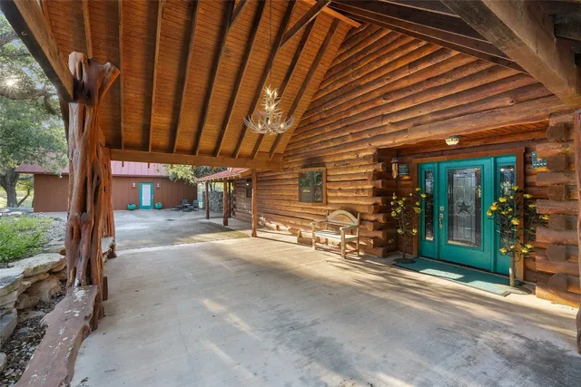 a swimming pool with outdoor seating and yard