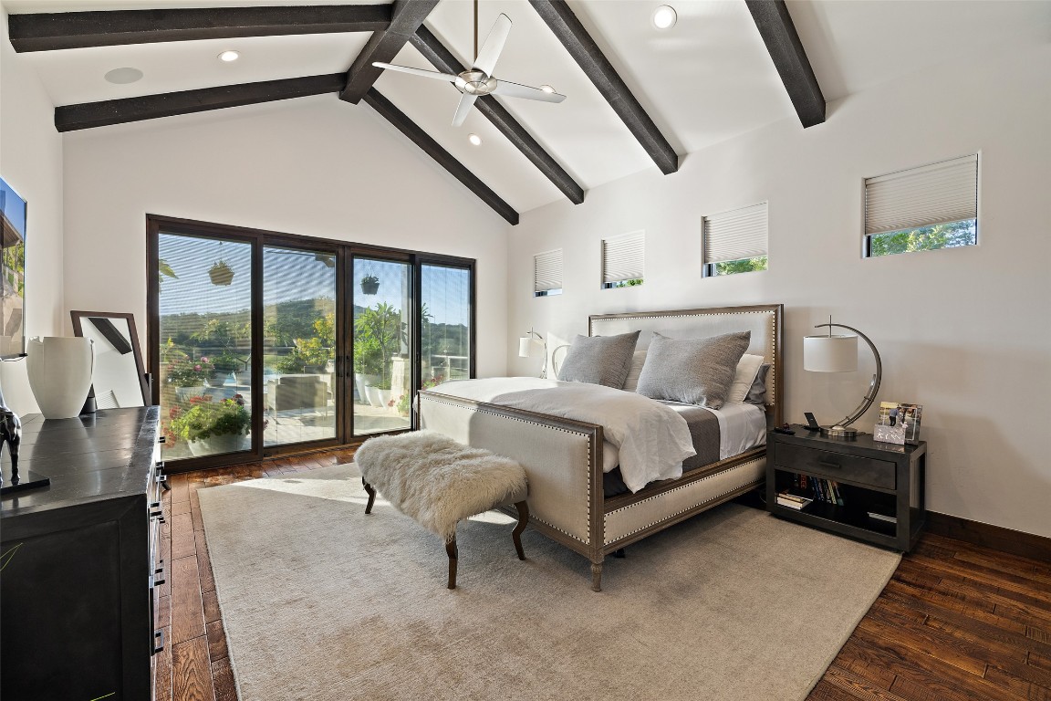 101 Rolling Hills Road Blanco, TX 78606 - Photo 6 of 38 a bedroom with a bed and large window