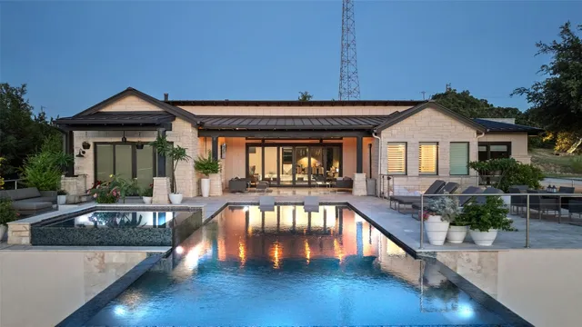 a view of a house with pool and wooden floor