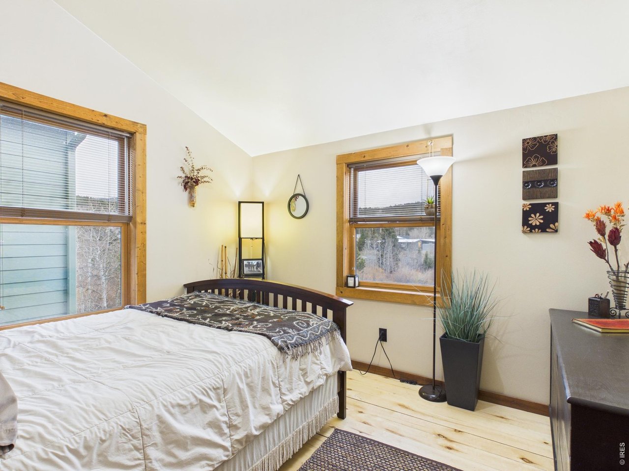 131 West Boulder Street Nederland, CO 80466 - Photo 24 of 46 Mountain views, wood windows, vaulted ceiling, wood flooring.