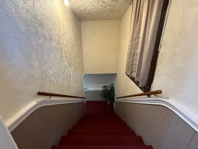 a living room with furniture and flat screen tv