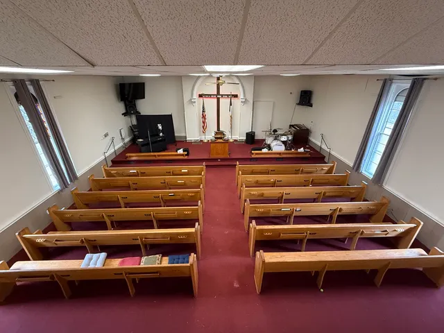 a bedroom with a bed and dresser