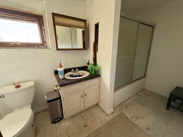 a bathroom with a sink and toilet