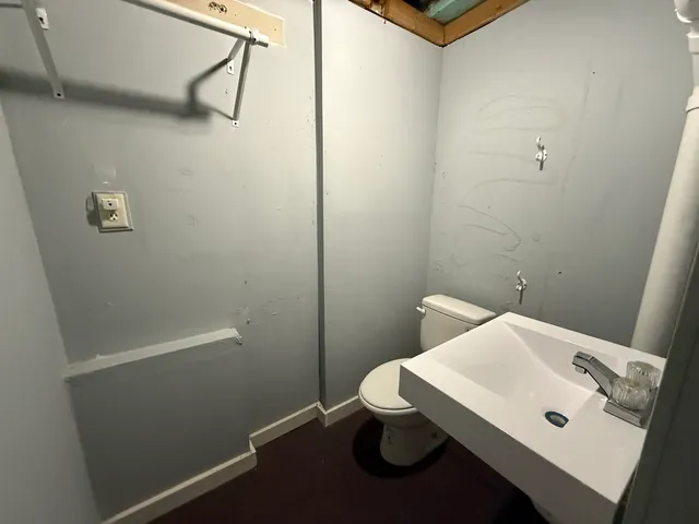 a view of a house with a patio and a yard