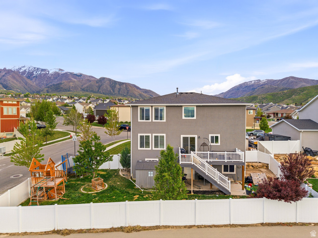 256 West Horizon Loop Payson, UT 84651 - Photo 31 of 33 Back of property featuring a residential view, a fenced backyard, a mountain view, and stucco siding