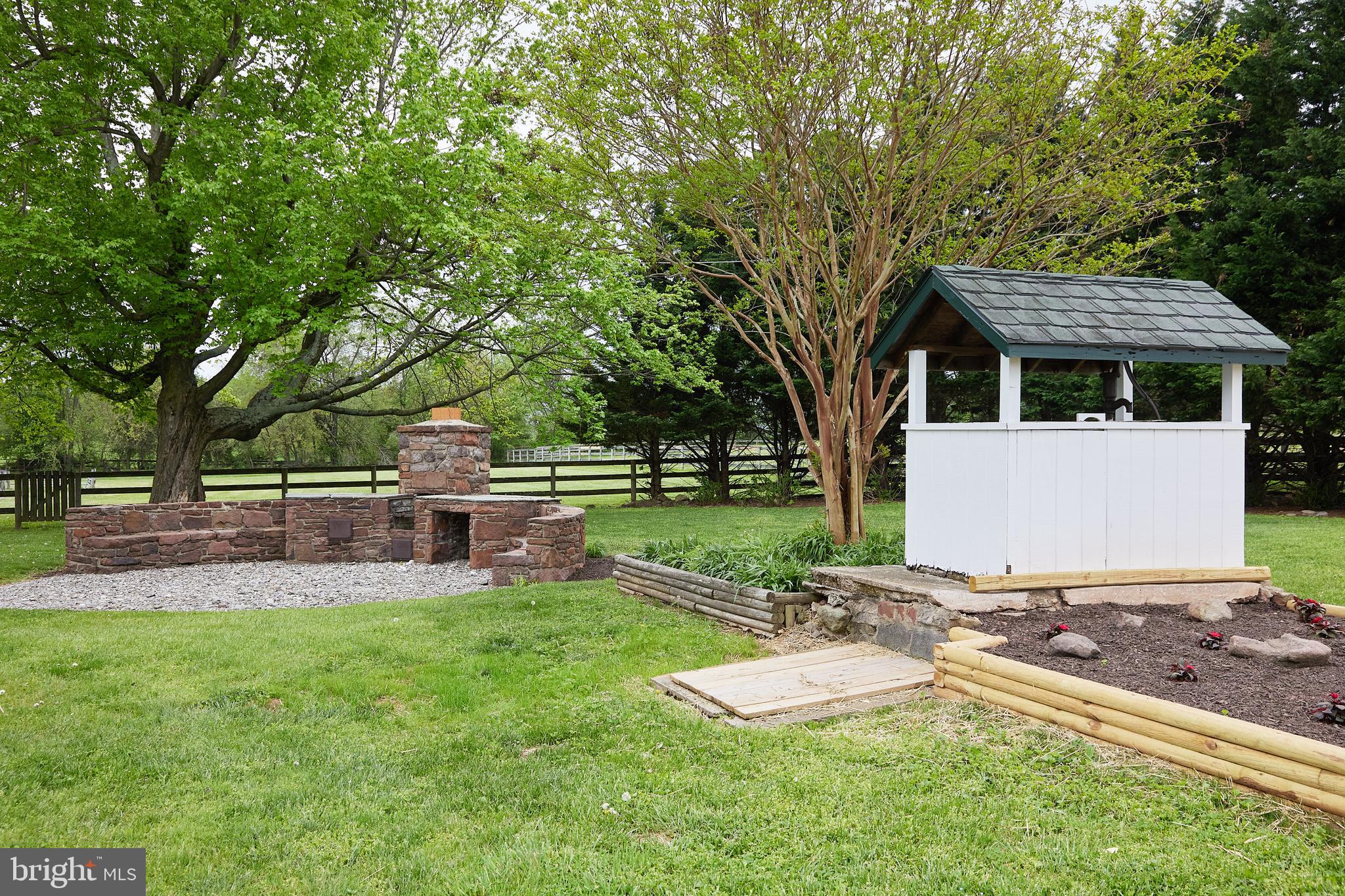18410 Beallsville Road Poolesville, MD 20837 - Photo 34 of 55 Outdoor fireplace and gardens