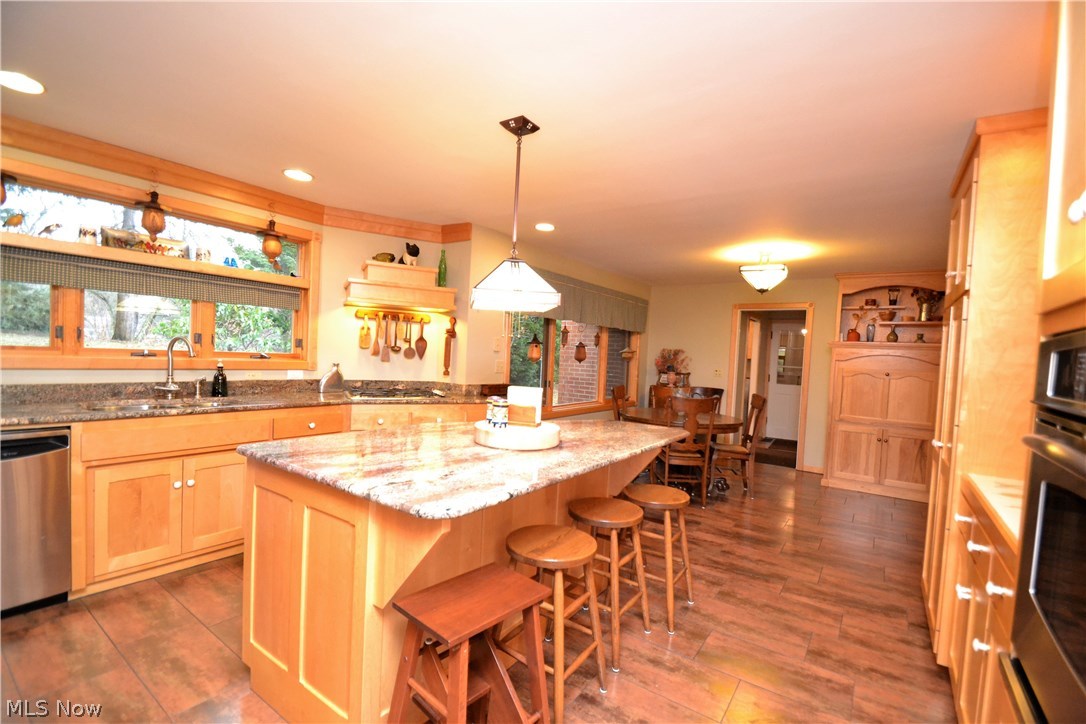 2737 Glenmont Road Northwest Canton, OH 44708 - Photo 3 of 33 Beautiful kitchen with large subway tile floor and granite counters