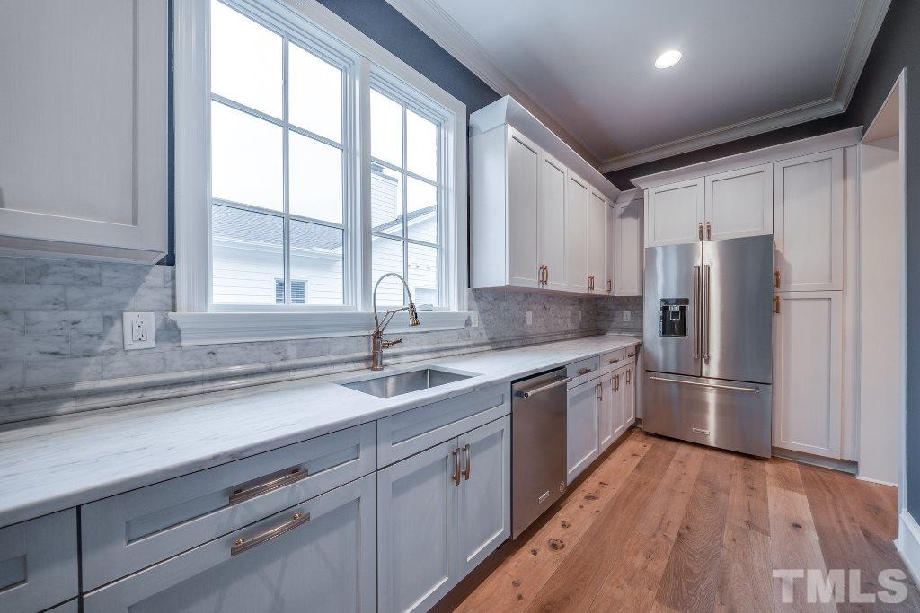 2015 Reaves Drive Raleigh, NC 27608 - Photo 14 of 30 a kitchen with stainless steel appliances granite countertop a refrigerator and a sink
