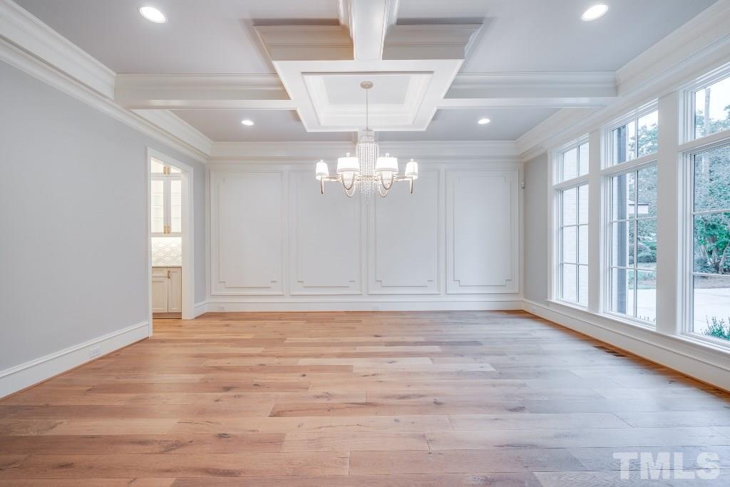 2015 Reaves Drive Raleigh, NC 27608 - Photo 3 of 30 a view of an empty room with wooden floor and a window