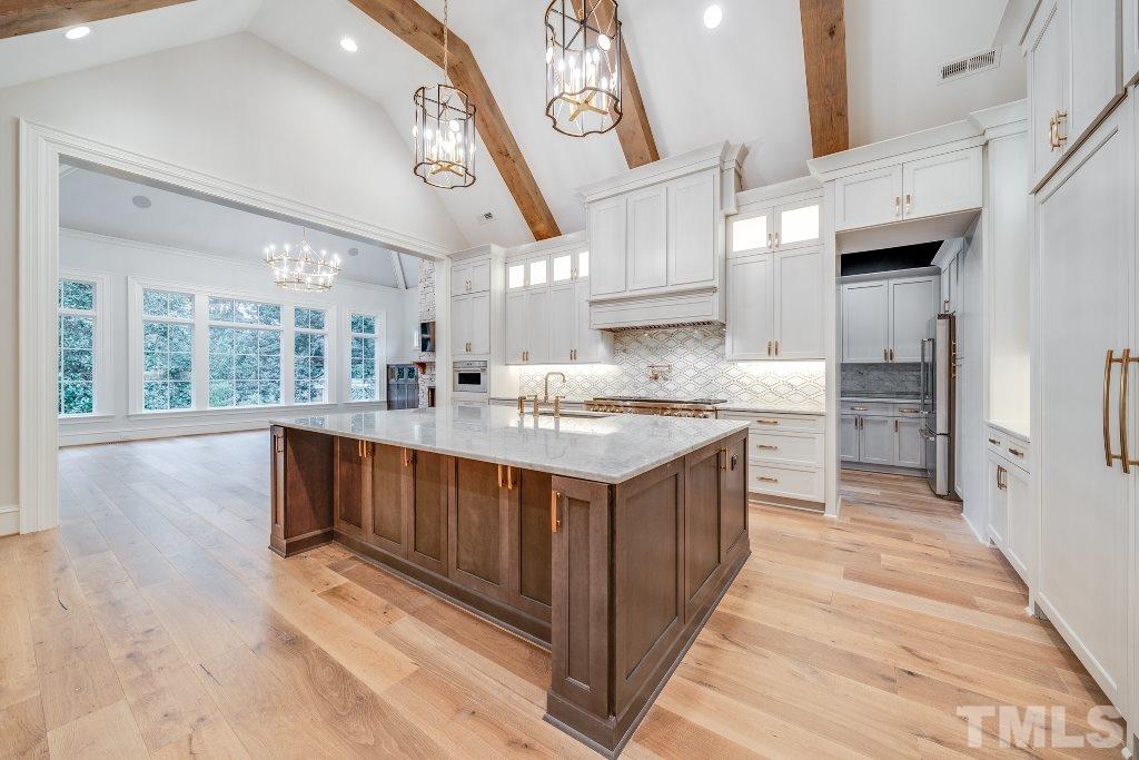 2015 Reaves Drive Raleigh, NC 27608 - Photo 8 of 30 a kitchen with stainless steel appliances granite countertop a sink and a stove