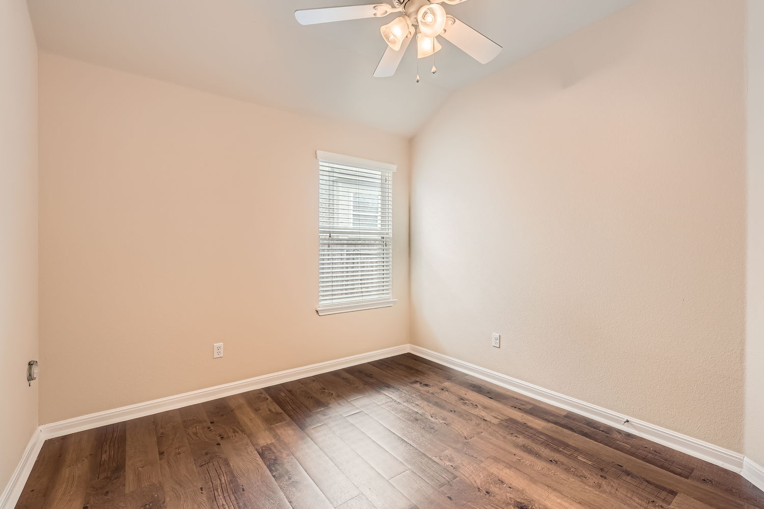 547 Stone View Trail, Unit 112 Austin, TX 78737 - Photo 20 of 28 an empty room with wooden floor and windows