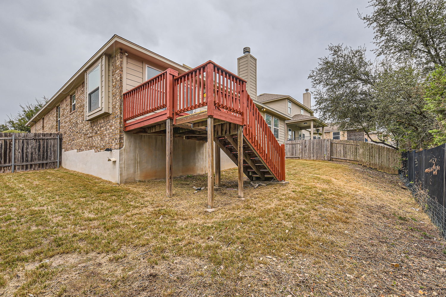547 Stone View Trail, Unit 112 Austin, TX 78737 - Photo 27 of 28 a view of a house with a yard