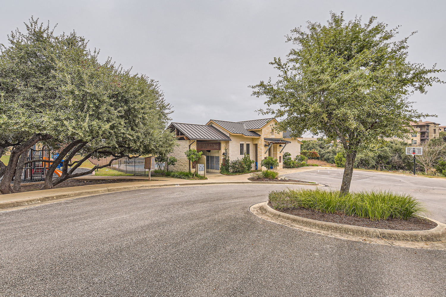 547 Stone View Trail, Unit 112 Austin, TX 78737 - Photo 28 of 28 a front view of a house with a garden and trees