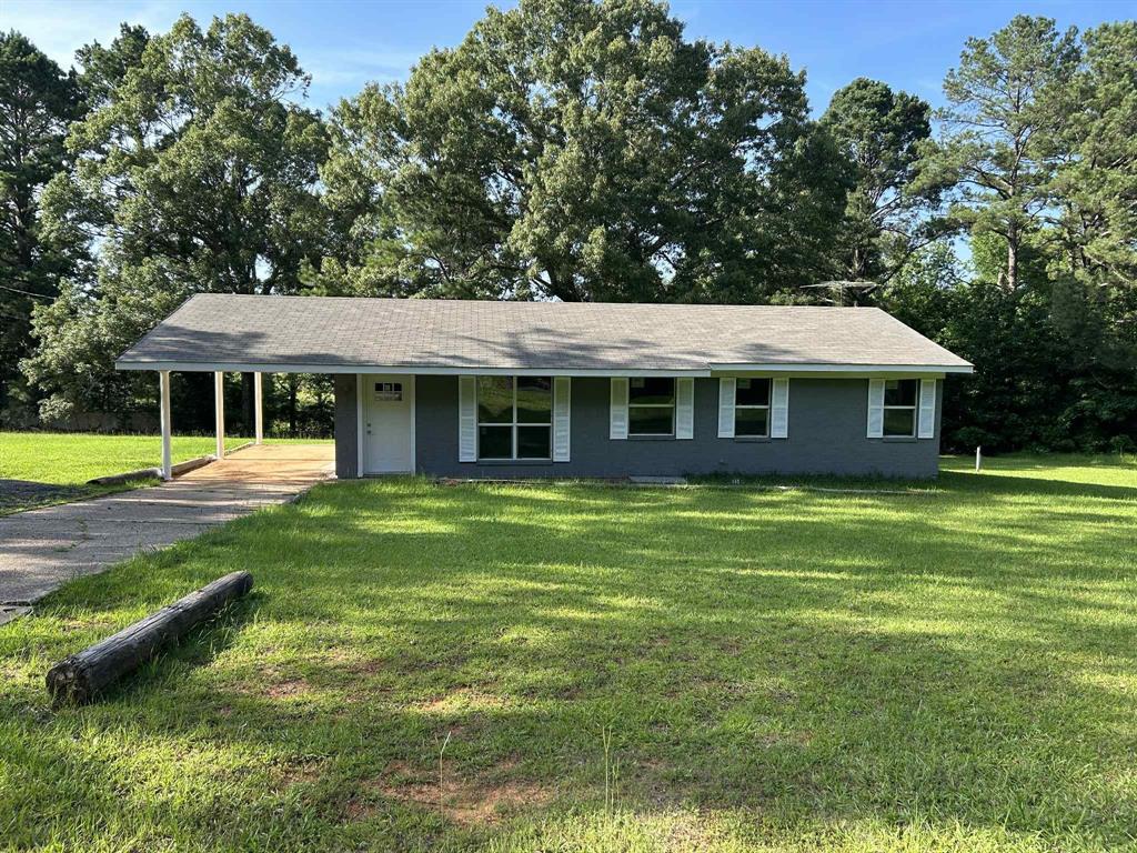 1454 Cotton Belt Road Mansfield, LA 71052 - Photo 1 of 1 Ranch-style home with a carport, a front lawn, and driveway
