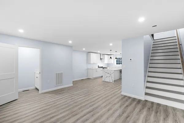 a view of a kitchen with wooden floor