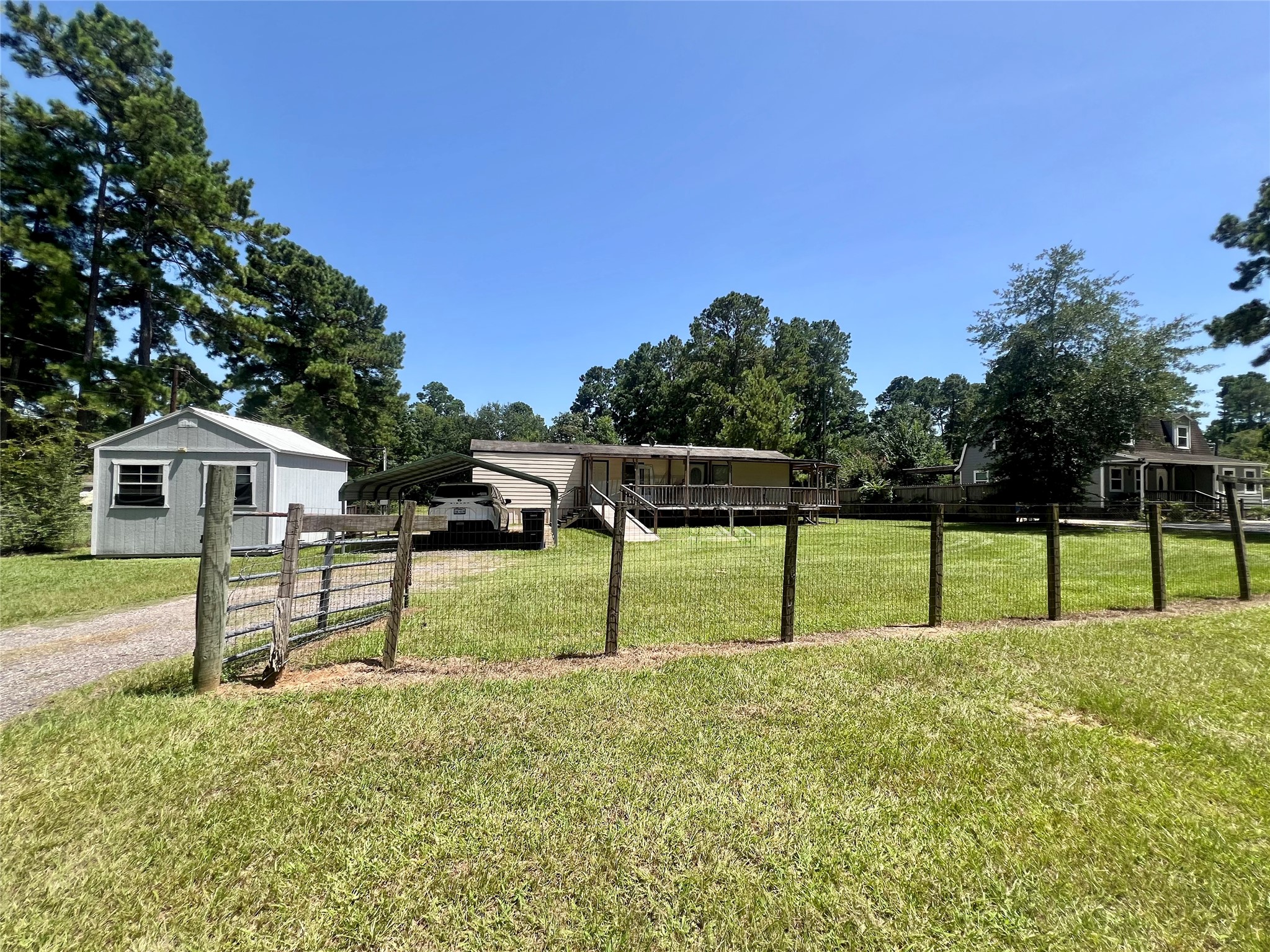 31018 Green Tree Road Magnolia, TX 77354 - Photo 1 of 23 Fenced across the front of property