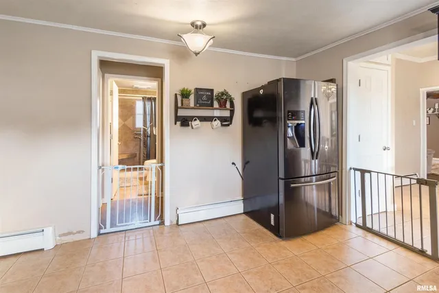 a kitchen with stainless steel appliances a refrigerator and microwave