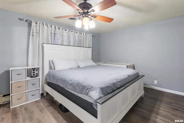 a bed room with a bed and a chandelier