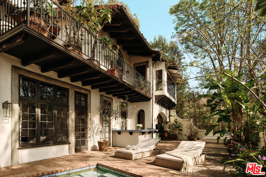 2729 Nichols Canyon Road Los Angeles, CA 90046 - Photo 1 of 1 a view of a patio with table and chairs and potted plants