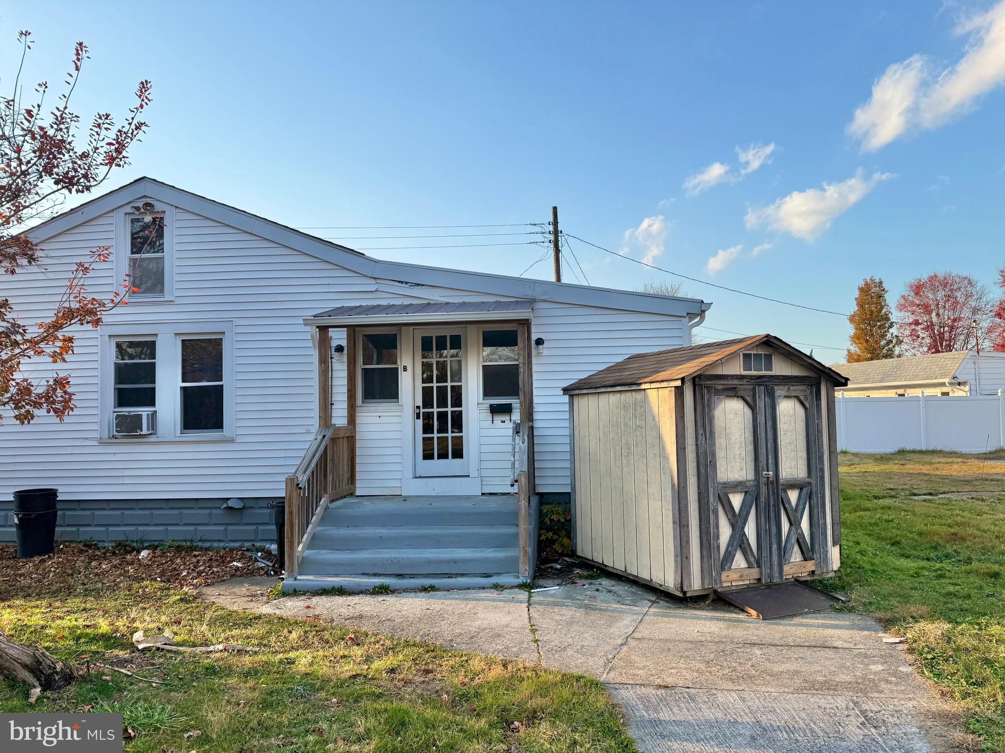 50 Chestnut Street, Unit B Pennsville, NJ 08070 - Photo 2 of 19 Unit B door is on the side of the duplex building
