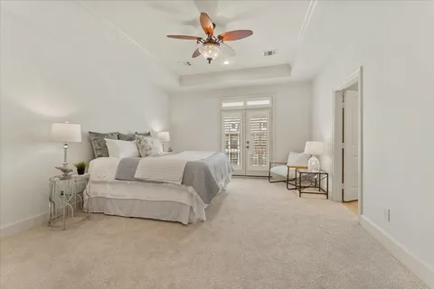 a bed room with a bed and a chair